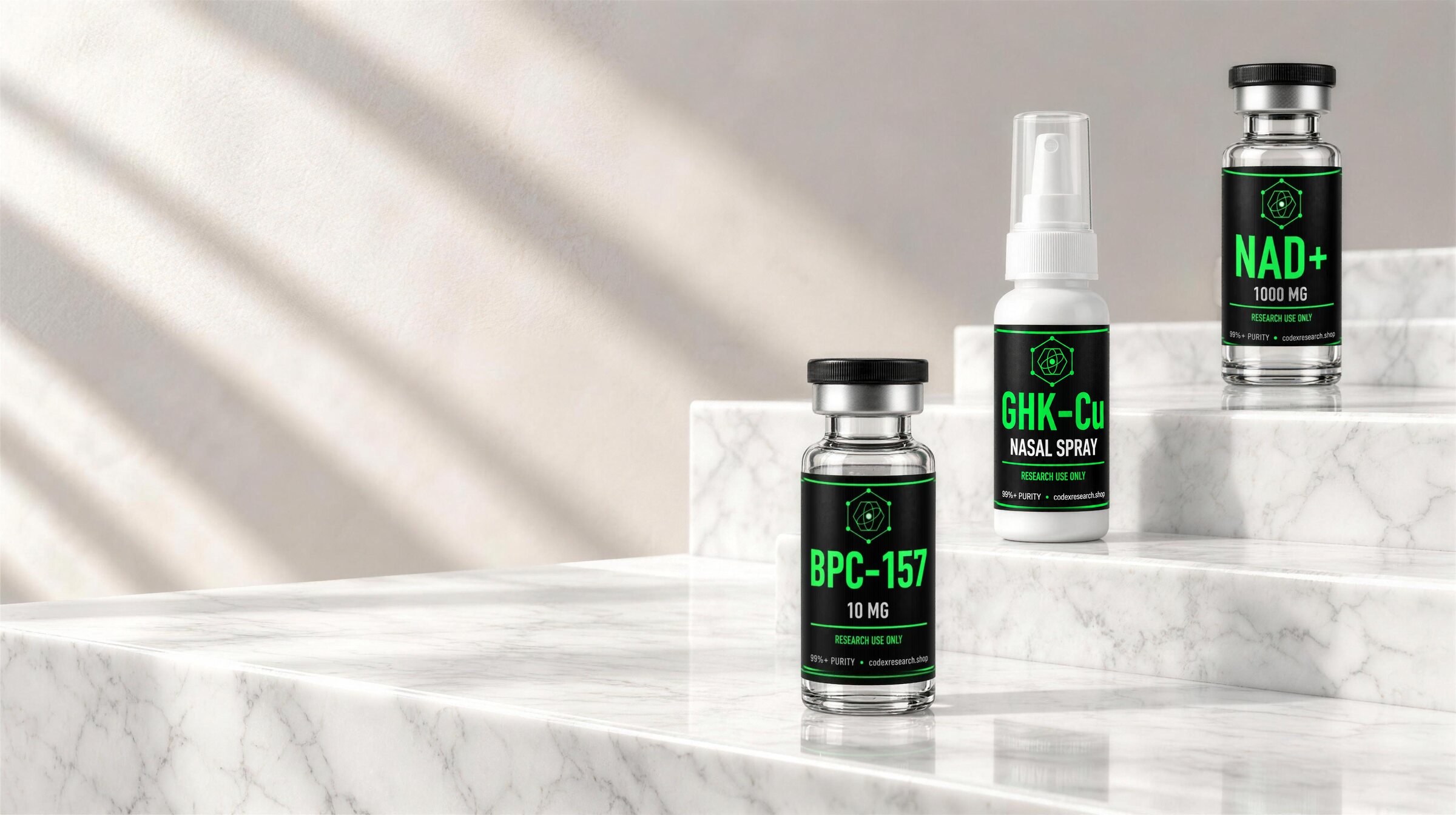 Codex Research vials and nasal sprays on travertine and marble steps
